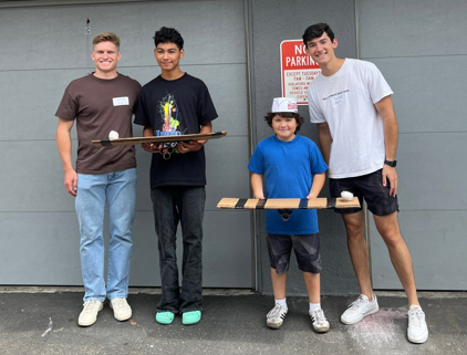 Young people who have aged out of foster care with handmade longboards