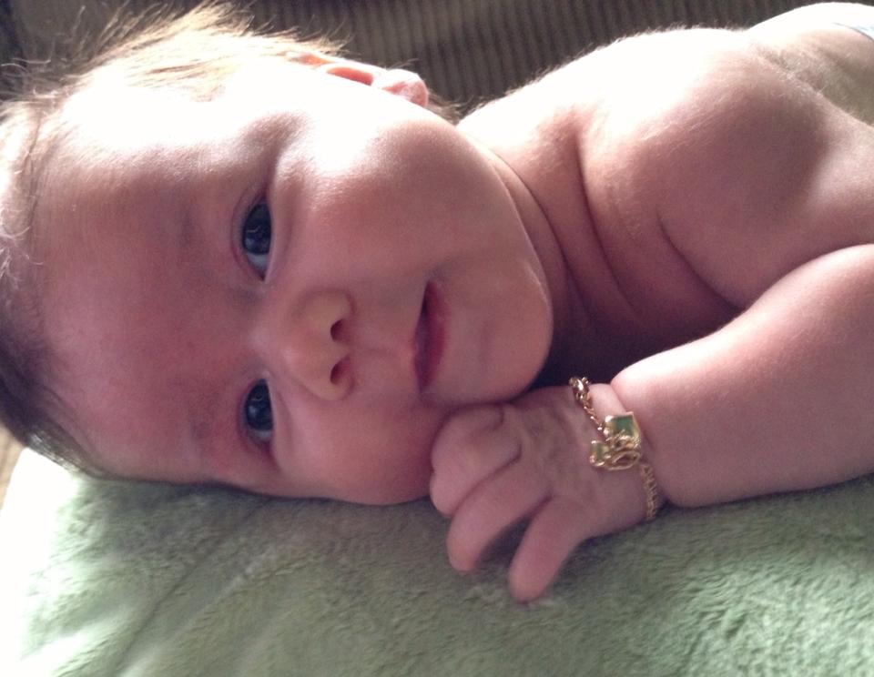 Close-up of baby Savannah wearing her gold bracelet